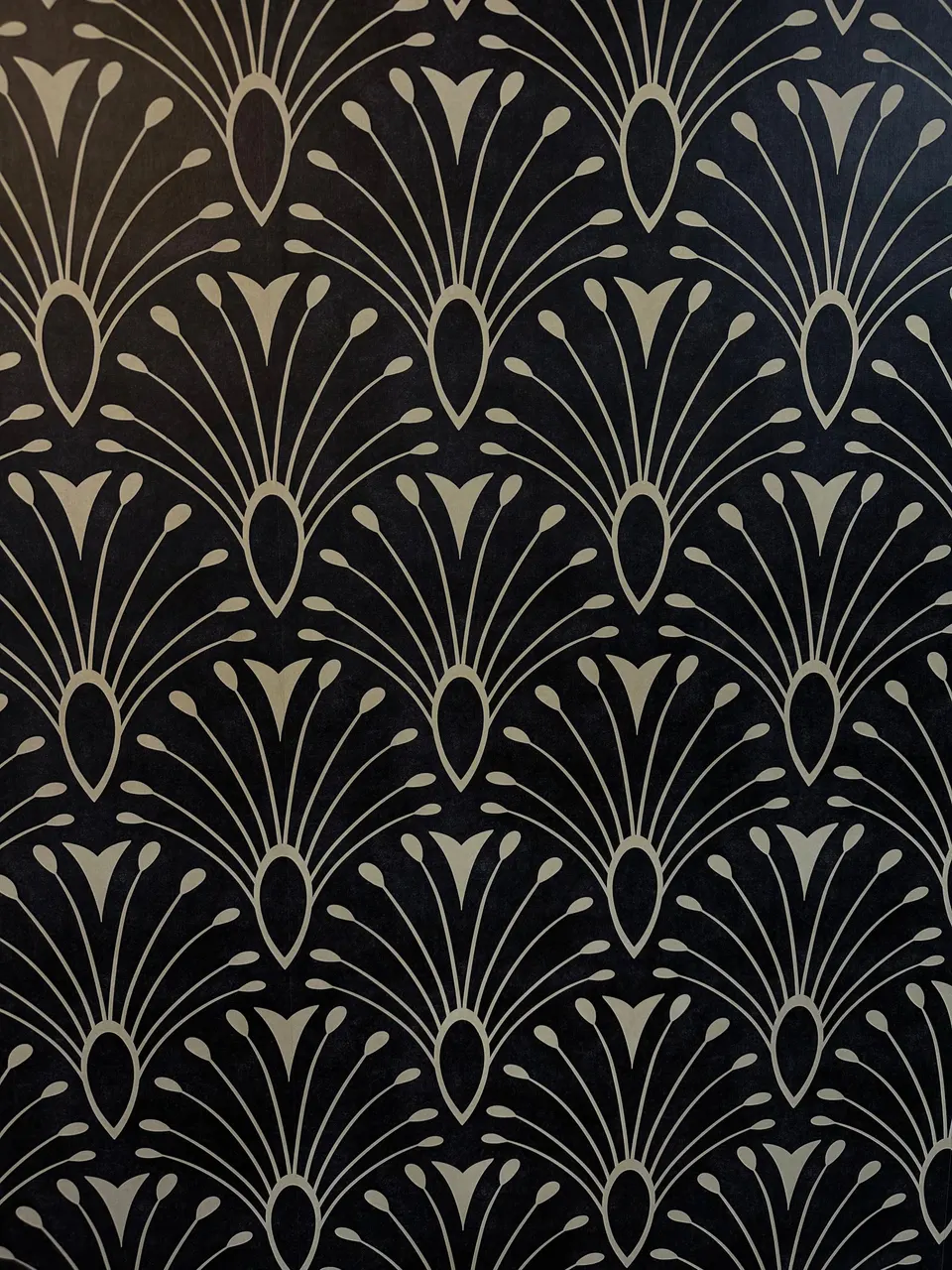 Gold-on-black Art Deco fan wallpaper inside The Zimmerman