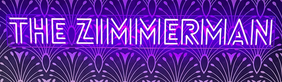 Neon lettering spelling The Zimmerman